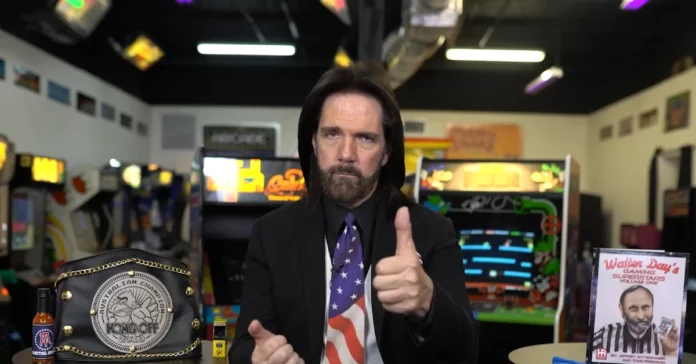 Billy Mitchell Net Worth Billy Mitchell beside classic arcade machines, holding a restaurant menu and legal documents, symbolizing gaming fame and business success.