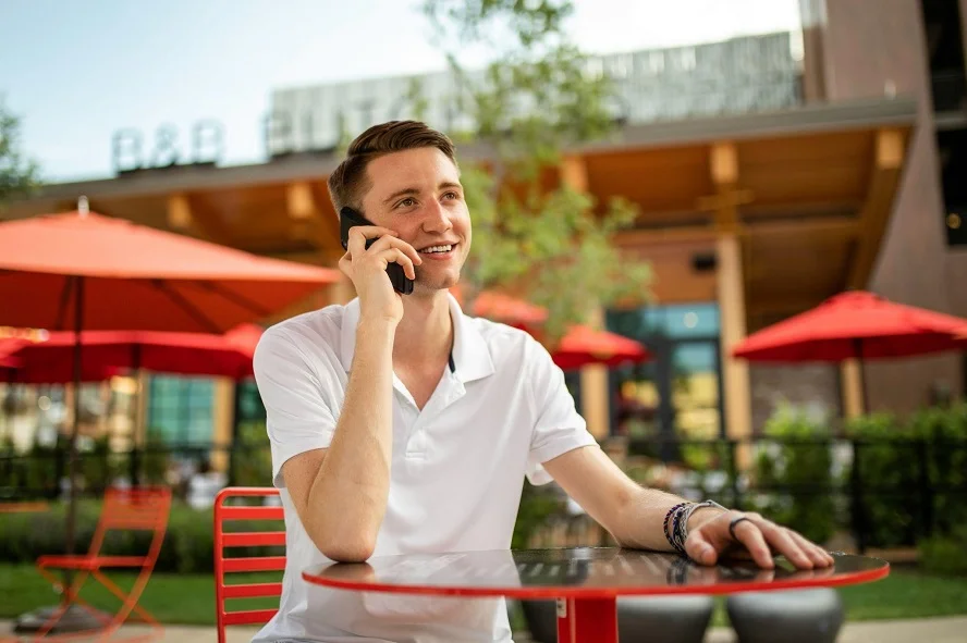 Traveler using eSIM-enabled phone for seamless calls and data in 2025