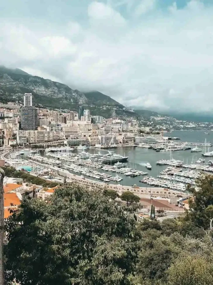 A scenic view of Monaco’s marina with luxury yachts and upscale buildings, showcasing the charm of luxury holidays on the French Riviera.