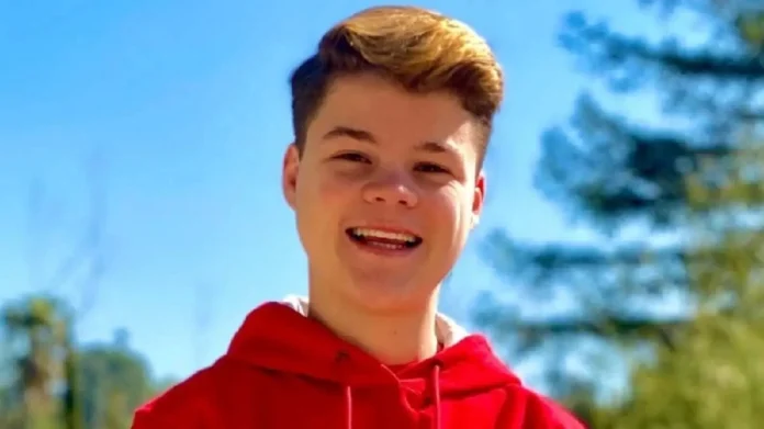 Jack Doherty Net Worth- Jack Doherty posing with luxury cars and a mansion, representing his success and lifestyle—perfect visual for the topic “jack doherty net worth”.