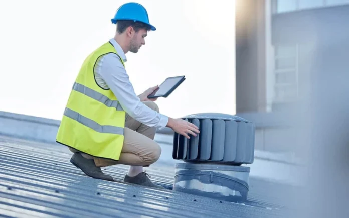 Professional roofing inspector conducting a routine inspection on a commercial building’s flat roof to identify maintenance issues and prevent costly damage.