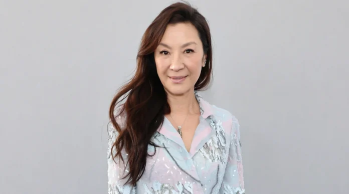 Michelle Yeoh Net Worth 2026_ Career, Income & Success Michelle Yeoh smiling at a red carpet event for a feature about her net worth, career, and success.
