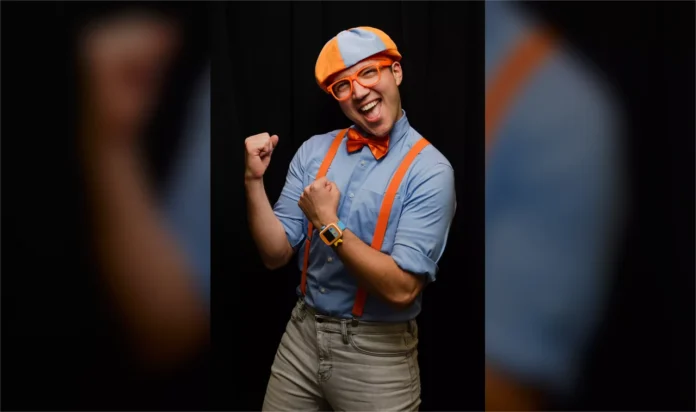 Clayton Grimm Net Worth and Blippi Career Clayton Grimm performing as Blippi in blue and orange costume