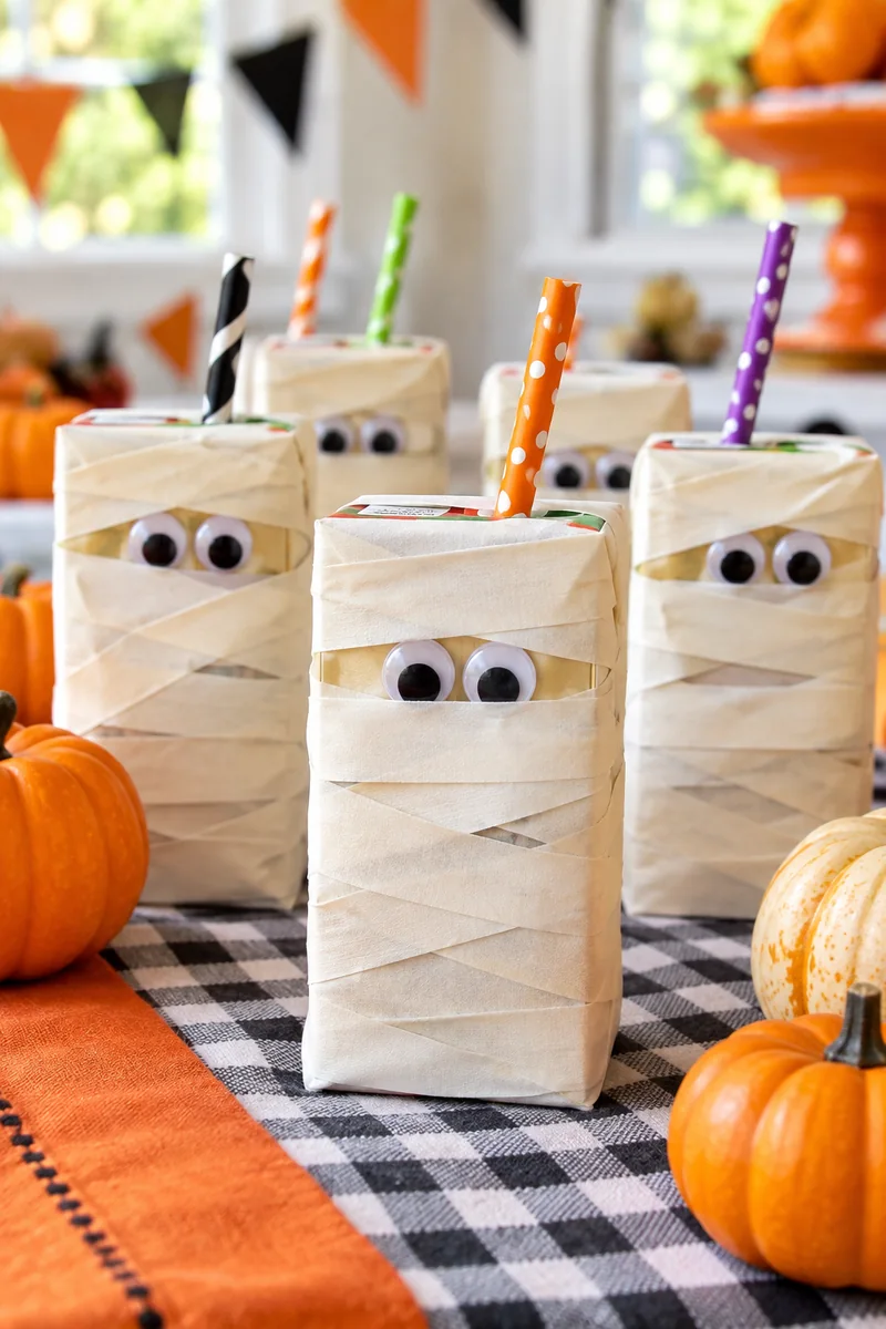 20 Easy Halloween Snacks You Can Make in Minutes 4 Mummy wrapped juice boxes with googly eyes
