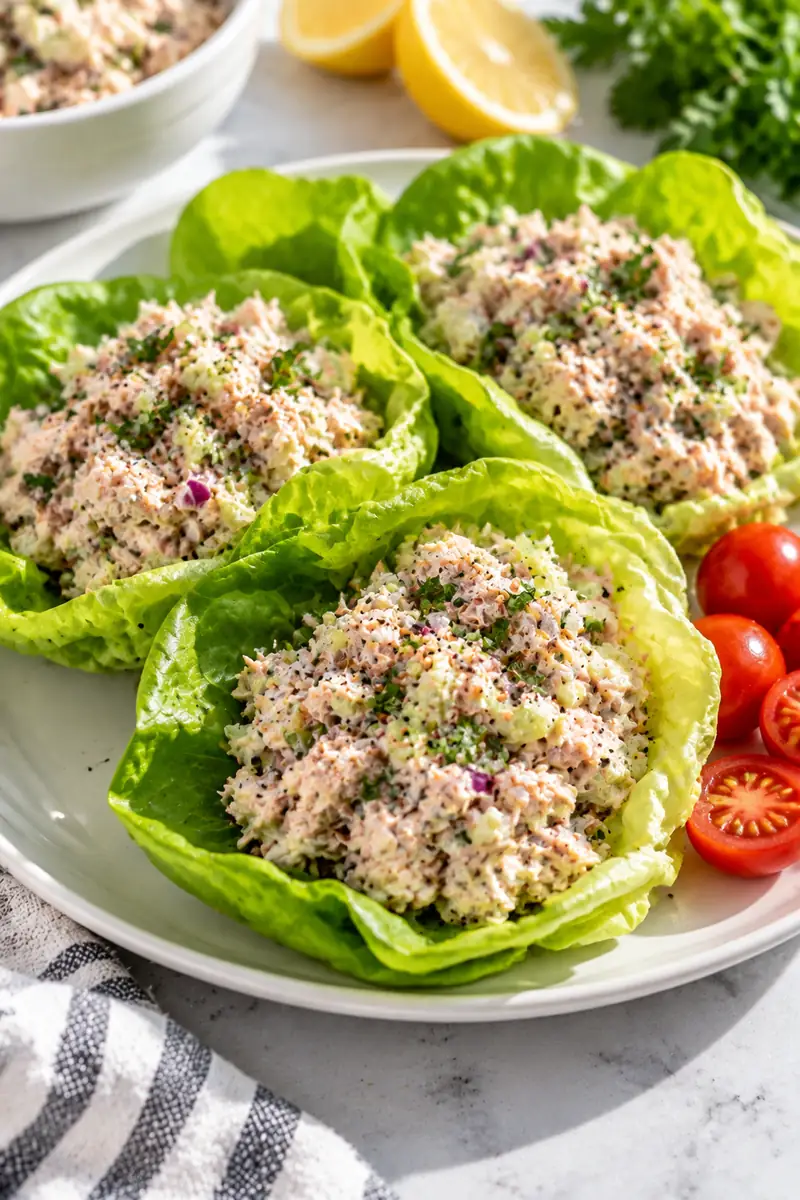 18 No-Cook Afternoon Snacks for Busy Days 4 Tuna salad spooned into crisp butter lettuce cups on a white plate
